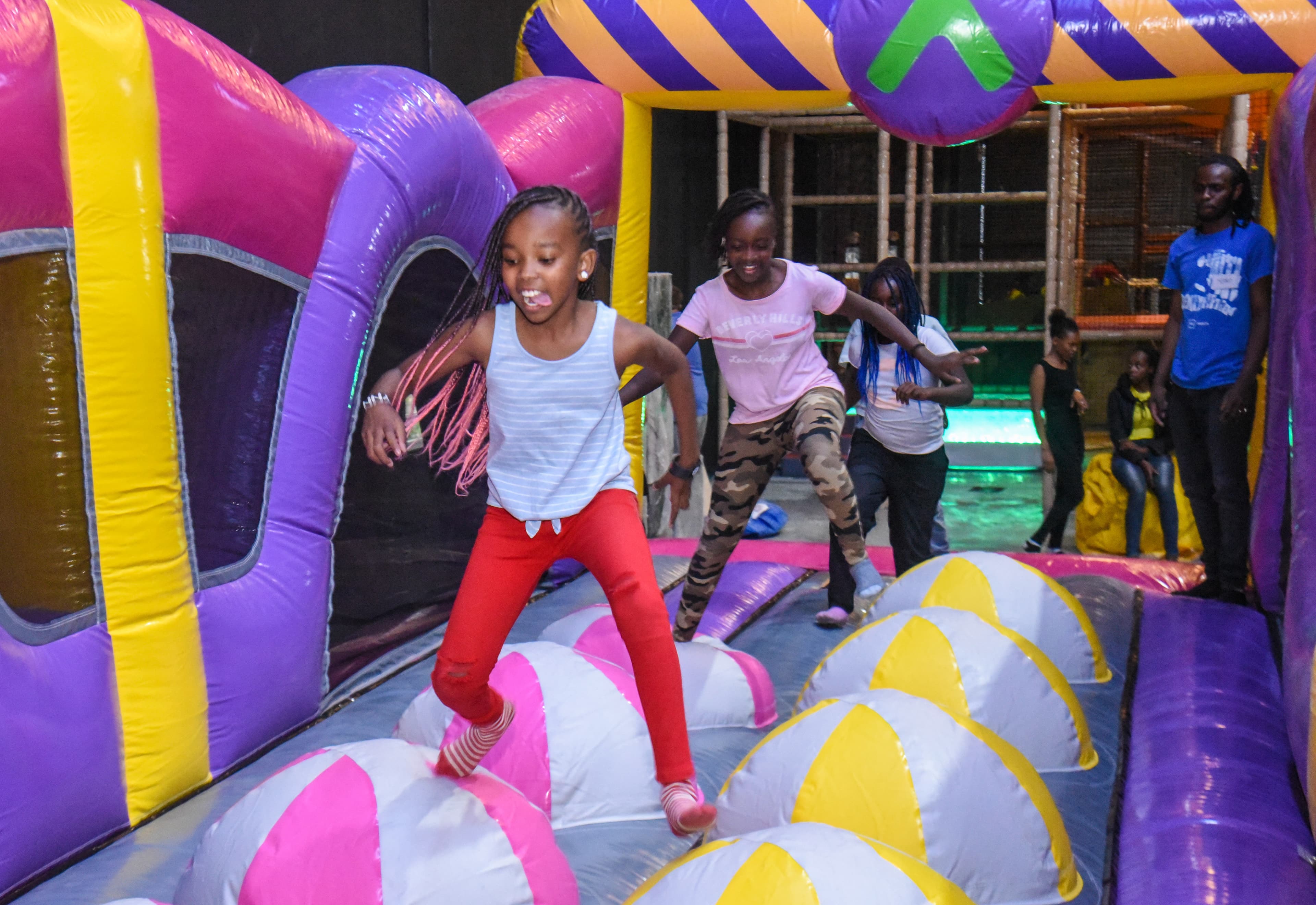 Family participating in park activities at The Hub Park, a top trampoline bounce park and fun zone in Nairobi.
